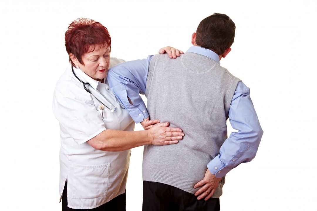 doctor examining a patient with back pain